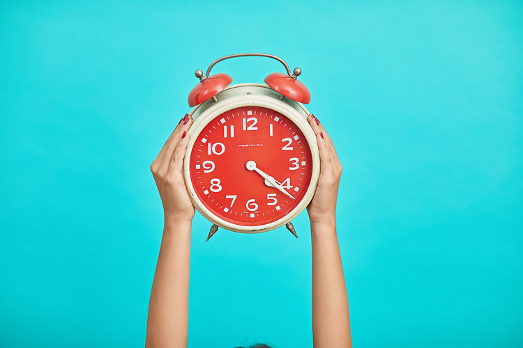 Limited company director holding clock