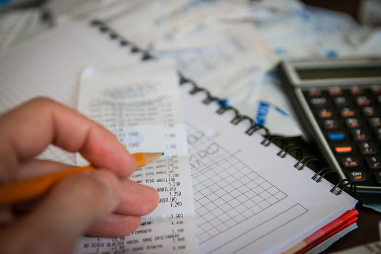 Self employed individual with their tax receipts